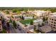 An aerial view of an intersection, featuring a green square for recreation, with retail and residential surrounding at 385 Rowes Cir, Alpharetta, GA 30009