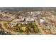 Expansive aerial view of mixed-use development featuring retail, restaurants, apartments and surrounding neighborhoods at 385 Rowes Cir, Alpharetta, GA 30009