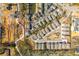 Overhead shot of a residential community, showcasing modern homes, landscaping, and surrounding nature at 385 Rowes Cir, Alpharetta, GA 30009