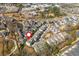 Scenic aerial of a neighborhood with picturesque pond, green spaces, and well-maintained landscaping at 385 Rowes Cir, Alpharetta, GA 30009