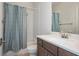 Bright bathroom with white subway tile shower, and dark wood vanity with white countertop at 385 Rowes Cir, Alpharetta, GA 30009