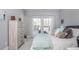 Serene bedroom with soft gray walls, comfortable bed, and a window offering natural light at 385 Rowes Cir, Alpharetta, GA 30009
