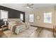 Stylish bedroom with hardwood floors, neutral tones, and ample natural light at 385 Rowes Cir, Alpharetta, GA 30009