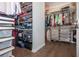 Organized walk-in closet with ample shelving, drawers, and hanging space at 385 Rowes Cir, Alpharetta, GA 30009