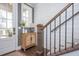 Welcoming foyer with hardwood floors, a storage cabinet, and elegant shiplap wall accents at 385 Rowes Cir, Alpharetta, GA 30009