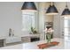 Modern kitchen island with white countertops, stylish pendant lights, and stainless steel appliances at 385 Rowes Cir, Alpharetta, GA 30009
