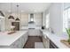 Elegant kitchen featuring white cabinetry, stainless steel appliances, and stylish fixtures at 385 Rowes Cir, Alpharetta, GA 30009