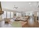 Spacious living room with hardwood floors and many windows offering ample natural light at 385 Rowes Cir, Alpharetta, GA 30009