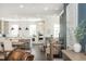 Spacious living area featuring modern appliances, kitchen island and dining area at 385 Rowes Cir, Alpharetta, GA 30009