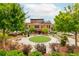 Scenic outdoor space with lush landscaping and seating areas for relaxing or entertaining at 385 Rowes Cir, Alpharetta, GA 30009