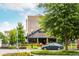 A street-level view of a restaurant featuring a well-kept lawn with colorful foliage in foreground at 385 Rowes Cir, Alpharetta, GA 30009