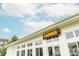 Chiringa restaurant exterior with white siding and large windows, ideal for an evening meal at 385 Rowes Cir, Alpharetta, GA 30009