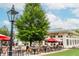 Inviting outdoor seating area at an Indian restaurant, surrounded by greenery and charming ambiance at 385 Rowes Cir, Alpharetta, GA 30009