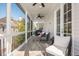 Relaxing screened porch with ceiling fans, comfortable seating, and a view of the outdoors at 385 Rowes Cir, Alpharetta, GA 30009