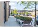 Street view showcasing the sidewalk, landscaping, and various shopfronts in the community at 385 Rowes Cir, Alpharetta, GA 30009