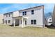 A well-maintained backyard featuring an unfinished lawn and an exterior view of the house at 4594 Eastbrook Pl, Snellville, GA 30039