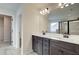 Bathroom featuring a dual sink vanity, and a walk-in shower at 4594 Eastbrook Pl, Snellville, GA 30039