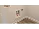 Laundry room with water hookups, electrical outlets, and baseboard trim at 4594 Eastbrook Pl, Snellville, GA 30039