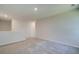 Bright, open loft area with neutral carpeting, offering versatile space for relaxation or entertainment at 4594 Eastbrook Pl, Snellville, GA 30039