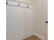 Mud room including a white wall-mounted coat rack with black hooks at 4594 Eastbrook Pl, Snellville, GA 30039