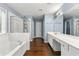 Bathroom features a tub, vanity, and separate shower space at 1761 Brandemere Dr, Austell, GA 30168