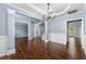 Elegant dining room featuring hardwood floors, stylish lighting, and ample space for entertaining at 1761 Brandemere Dr, Austell, GA 30168