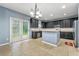 Modern kitchen with a center island, stainless steel appliances, and lots of natural light at 1761 Brandemere Dr, Austell, GA 30168