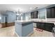 Modern kitchen features a center island, black cabinetry, and a stainless steel dishwasher at 1761 Brandemere Dr, Austell, GA 30168