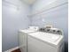Laundry room with utility shelving and washer and dryer at 1761 Brandemere Dr, Austell, GA 30168