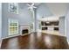 Open living room features a fireplace, large windows, and easy access to the kitchen at 1761 Brandemere Dr, Austell, GA 30168