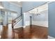Open living room with hardwood floors, staircase and an elegant chandelier enhancing the space at 1761 Brandemere Dr, Austell, GA 30168