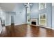 Bright living room with a fireplace, hardwood floors, large windows, and vaulted ceilings at 1761 Brandemere Dr, Austell, GA 30168