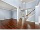 Spacious living room features hardwood floors, a staircase, and ample natural light at 1761 Brandemere Dr, Austell, GA 30168