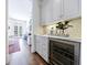 Stylish bar area with sleek cabinets, a beverage fridge, and marble countertops at 479 Argonne Nw Dr, Atlanta, GA 30305
