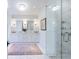 Bright bathroom features a double vanity, white marble floors, and a glass enclosed shower at 479 Argonne Nw Dr, Atlanta, GA 30305