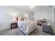 Bright bedroom with a large bed, patterned rug, a desk, and sitting area with cozy, neutral decor at 479 Argonne Nw Dr, Atlanta, GA 30305