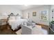 Sun-filled bedroom features a plush rug, sitting area, and three windows for abundant light at 479 Argonne Nw Dr, Atlanta, GA 30305