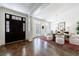 Formal dining room with dark wood floors, a chandelier, and seating for eight at 479 Argonne Nw Dr, Atlanta, GA 30305