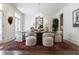 Bright dining room with a crystal chandelier, white walls, and access to an outdoor area at 479 Argonne Nw Dr, Atlanta, GA 30305