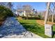 Long driveway leading up to a well-manicured lawn and charming residence at 479 at 479 Argonne Nw Dr, Atlanta, GA 30305