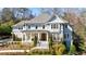 Stately two-story home with beautiful landscaping, symmetrical design and covered entryway with white pillars at 479 Argonne Nw Dr, Atlanta, GA 30305