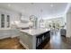 Gourmet kitchen with a large marble island, pendant lighting, and stainless steel appliances at 479 Argonne Nw Dr, Atlanta, GA 30305