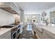 Chef's kitchen featuring a pro-grade range, farmhouse sink, and eat-in dining area at 479 Argonne Nw Dr, Atlanta, GA 30305
