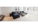 Spacious living room with a large sectional, custom built-ins, and a zebra print ottoman at 479 Argonne Nw Dr, Atlanta, GA 30305
