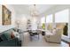 Sunlit living room featuring plush seating, refined décor, and large windows at 479 Argonne Nw Dr, Atlanta, GA 30305