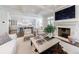 Bright open-concept living room with fireplace, and modern kitchen beyond, great for entertaining at 479 Argonne Nw Dr, Atlanta, GA 30305