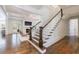 A grand foyer with hardwood floors leads to a spacious living room with fireplace and coffered ceilings at 479 Argonne Nw Dr, Atlanta, GA 30305
