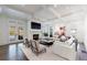 Cozy living room with coffered ceiling, fireplace, and large windows offering natural light at 479 Argonne Nw Dr, Atlanta, GA 30305