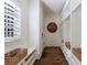 White mudroom featuring built in benches and storage on hardwood floors at 479 Argonne Nw Dr, Atlanta, GA 30305