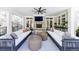 Outdoor patio featuring a fireplace, comfortable seating, and an extended living space at 479 Argonne Nw Dr, Atlanta, GA 30305